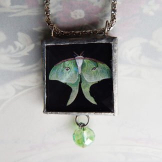 Danasimson.com Looking glass double-sided glass pendent Luna Moth. Beveled glass with a bead detail.