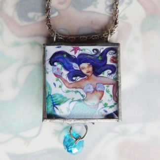 Danasimson.com Looking glass double-sided glass pendent mermaid. Beveled glass with a bead detail.