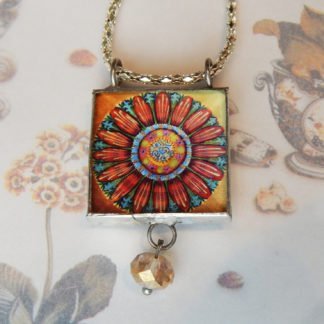 Danasimson.com front Looking glass double-sided glass pendent pop-art flower. Beveled glass with a bead detail.