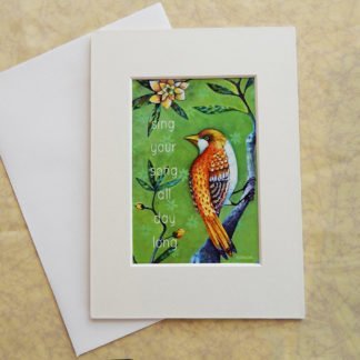 Danasimson.com Matted art card with envelope, "Sing your song, all day long" quote, golden bird image.