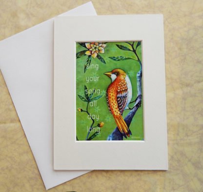 Danasimson.com Matted art card with envelope, "Sing your song, all day long" quote, golden bird image.