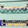 Danasimson.com two ceramic wall sculptures; canoes