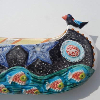 Danasimson.com Ceramic wall sculpture; canoe detail