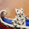 Danasimson.com Cat in canoe on wheels sculpture. detail cat