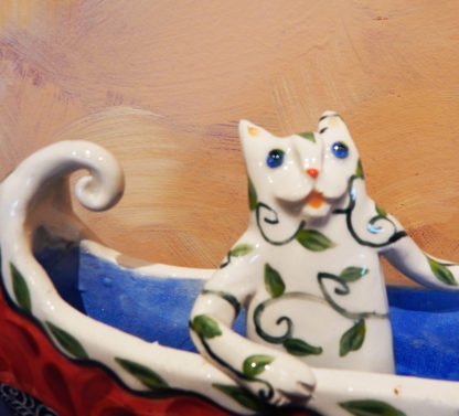 Danasimson.com Cat in canoe on wheels sculpture. detail cat