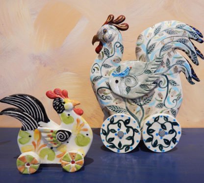 Danasimson.com Roosters on wheels sculptures.