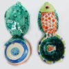 Danasimson.com Front and back Our handmade Fish handle Coffee Scoop is about 7 inches by 3,” in colorful ceramic. The handle is a raised design of a fish. A smaller fish is in the bowl of the scoop.