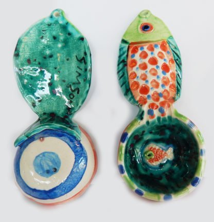 Danasimson.com Front and back Our handmade Fish handle Coffee Scoop is about 7 inches by 3,” in colorful ceramic. The handle is a raised design of a fish. A smaller fish is in the bowl of the scoop.