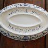 Danasimson.com Delft Blue birds "Happy.nest" Platter showing the bottom with phrase and where a personalized message or names would go.
