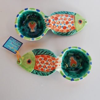 Danasimson.com Our handmade Fish handle Coffee Scoop is about 7 inches by 3,” in colorful ceramic. The handle is a raised design of a fish. A smaller fish is in the bowl of the scoop.