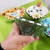 Danasimson.com The side view of the handmade ceramic bird bowl with the flow glaze defining a garden pattern