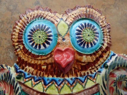 Danasimson.com Owl wall sculpture detail of head eyes and beak. Relief ceramic in colorful glazes.