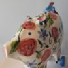 Danasimson.com Large pig sculpture with floral pattern on wheels.