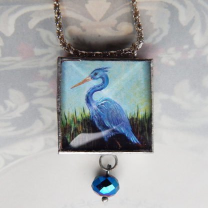 danasimson.com Handcrafted double sided beveled glass pendents with bead detail. Heron image.