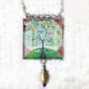 Danasimson.com Handcrafted double sided beveled glass pendent with bead detail. Many Birds One Tree image.