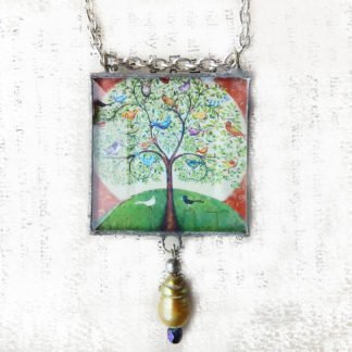 Danasimson.com Handcrafted double sided beveled glass pendent with bead detail. Many Birds One Tree image.