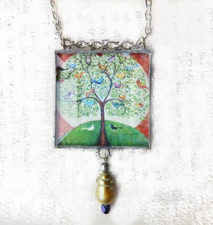 Danasimson.com Handcrafted double sided beveled glass pendent with bead detail. Many Birds One Tree image.