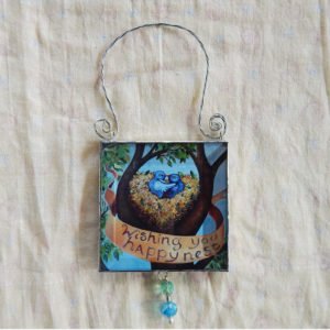 Danasmson.com Double sided beveled glass ornament with Happy Nest image. Twisted wire handle and bead detail.