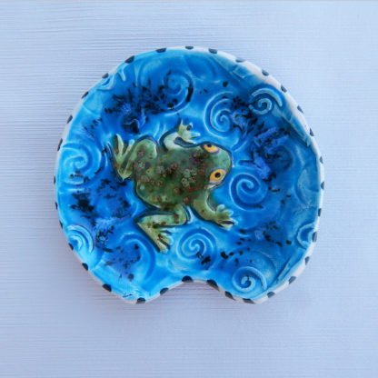 Danasimson.com Handmade ceramic frog spoon rest with colorful raised details.