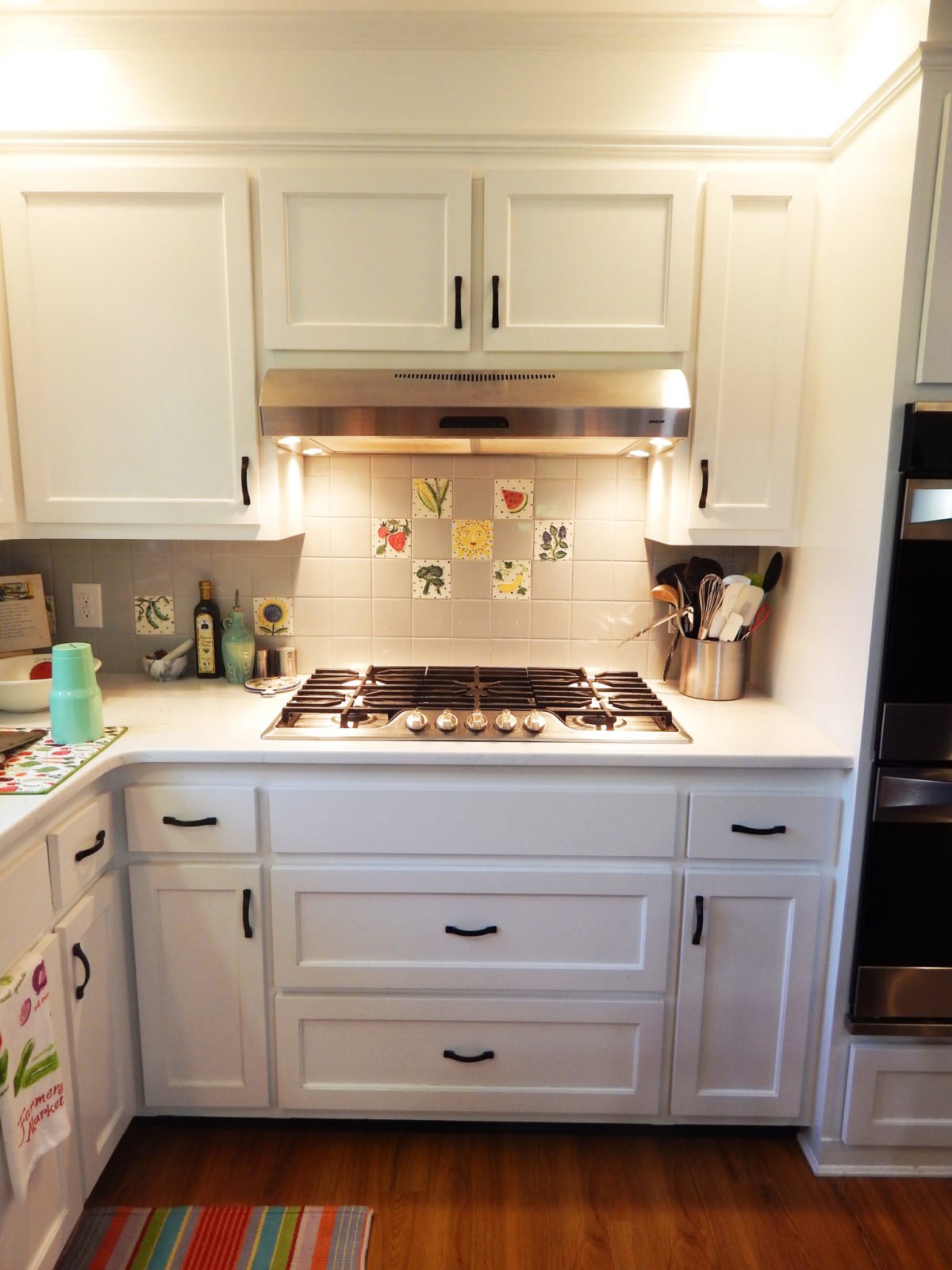 kitchen garden custom tiles behind the stove.