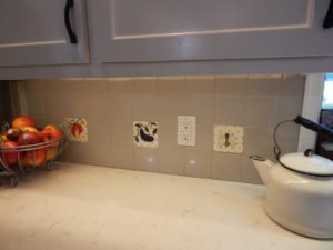 danasimson.com Custom garden tiles; peach, eggplant and bee, hand-sculpted relief with colorful glazes