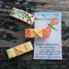 handcrafted ceramic hair clips with tag