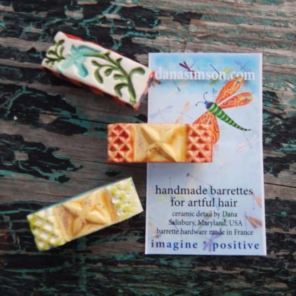 handcrafted ceramic hair clips with tag